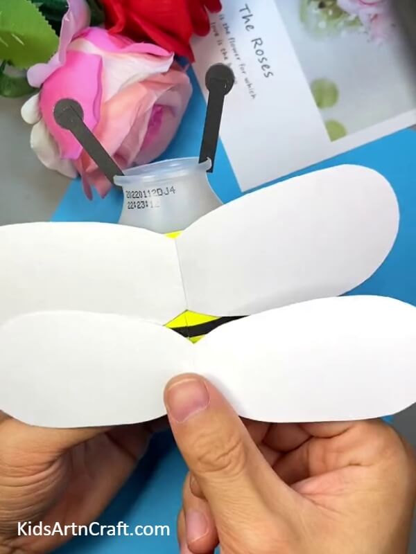 Stick The Wings-Follow this kid-friendly tutorial to make a bee out of a plastic bottle