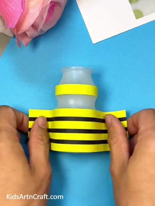 Stick The Bee's Body- Instructions on constructing a bee using a plastic bottle specifically for kids