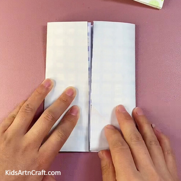 Folding right side of the craft paper into center- Prepare a Convenient Paper Origami Sleeve For Youngsters