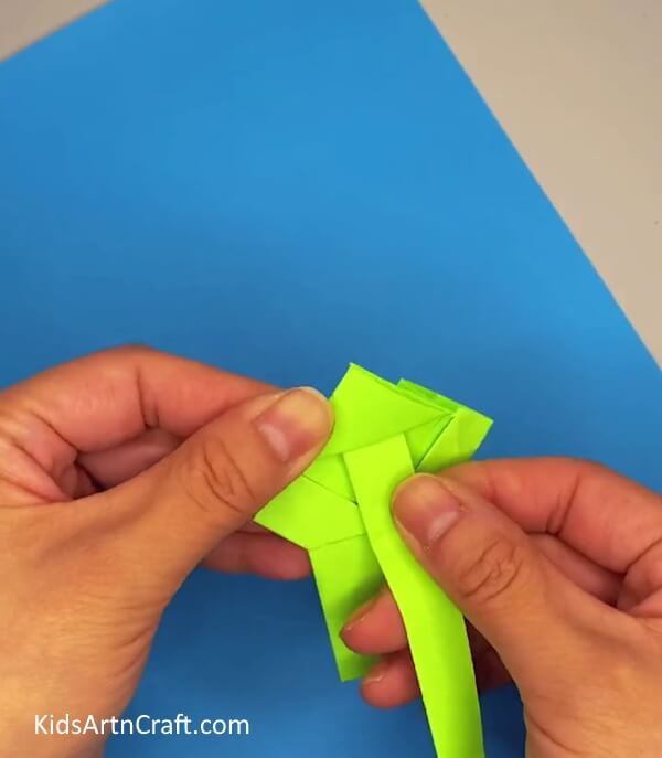 Pasting Stick In Frog's Mouth-. Building a Paper Frog Activity for Younger Children