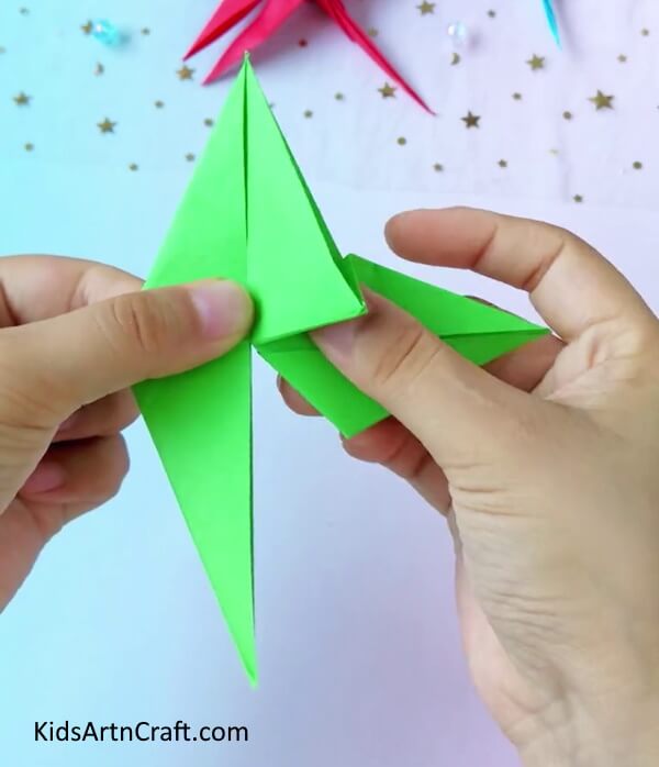 Folding to Create Wings of the Dragonfly- A tutorial to help children make a dragonfly from origami paper.