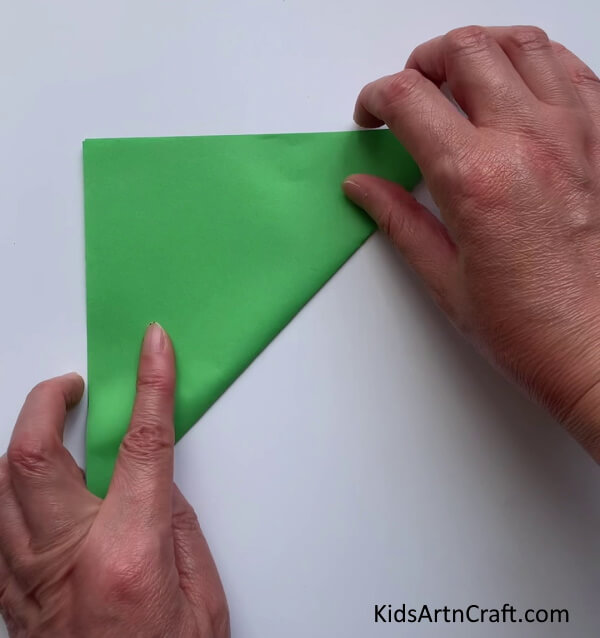 Folding Square Paper In Half Diagonally - Crafting a Charming Avian Finger Puppet For Kids