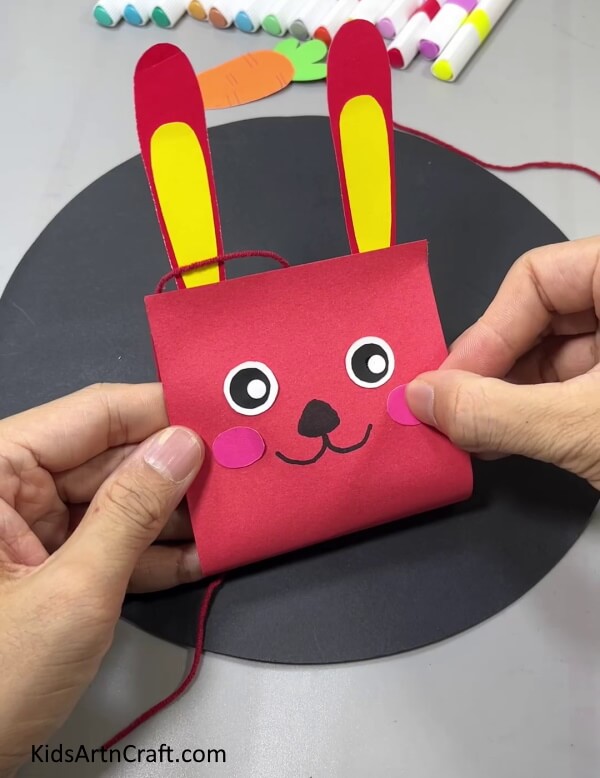 Making Cheeks Of The Bunny- Creating a hanging bunny and carrot decoration with paper is a breeze.