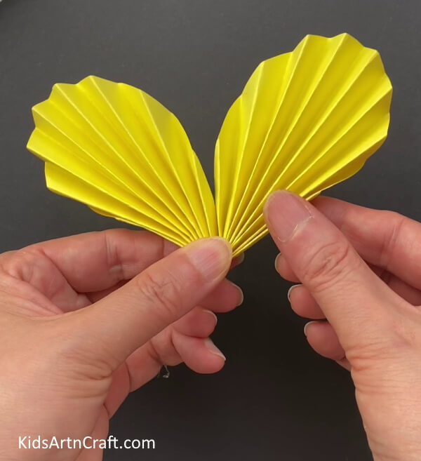 Folding The Strips From The Mid - Building a Paper Butterfly -- A Breezy Tutorial for Kids 