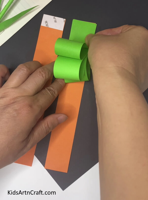 Pastin The Leaves Over Orange Strip A Step-by-Step Guide to Making a Paper Carrot for Children