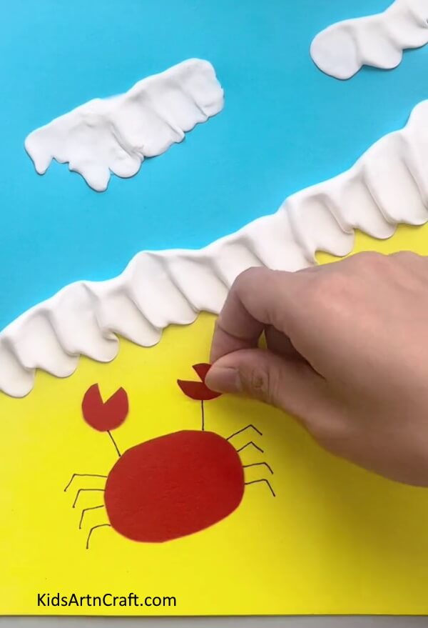 Making The Claws - Forming paper crabs on the sand for young ones 