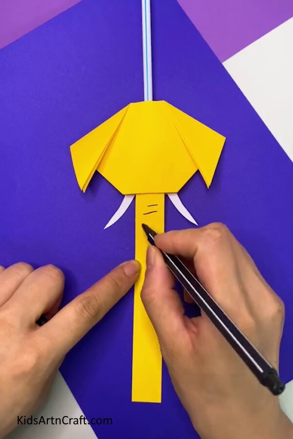 Drawing Some Lines- A paper elephant with a wiggling nose can be easily made by kids with this craft.