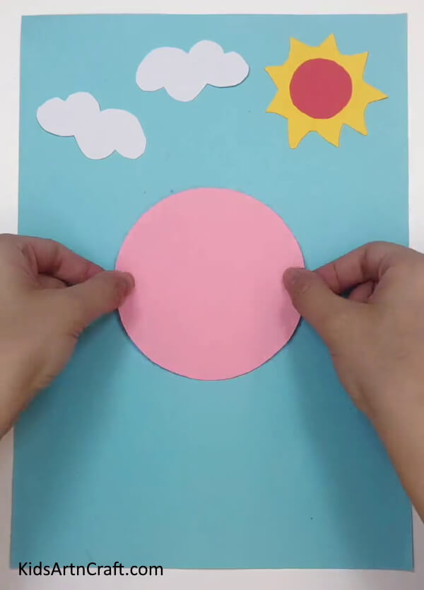 Cutting A Pink Circle - Making a Homemade Paper Princess Using a Step-by-Step Guide