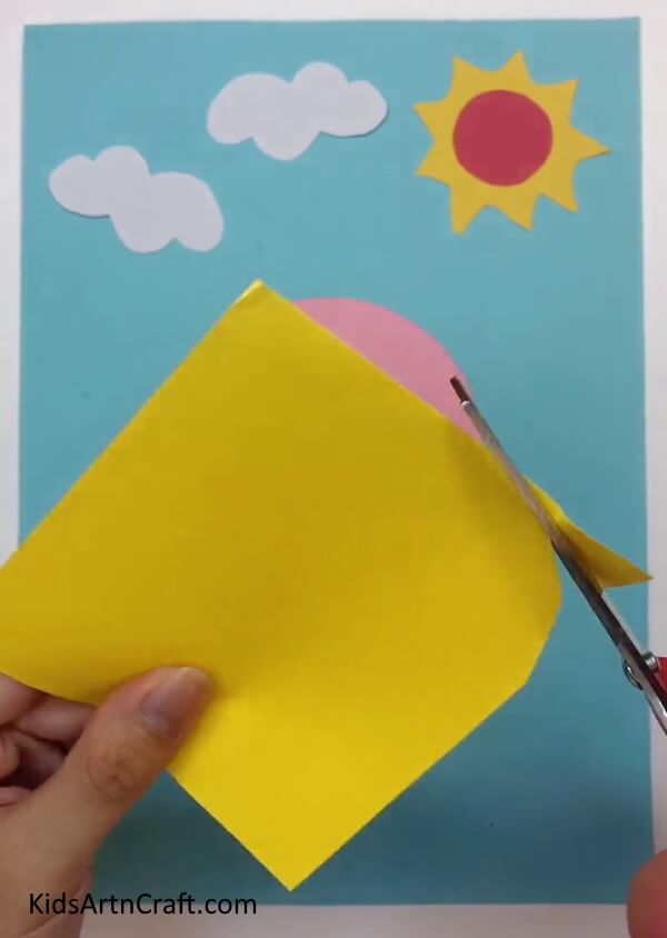 Making Cuts on A Yellow Paper - Learn How to Create a Paper Princess Using this Step-by-Step Guide