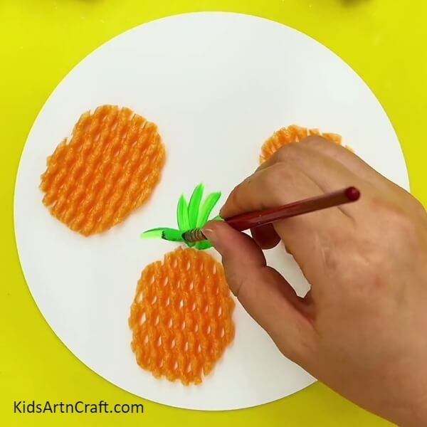 Painting The Crown - Create a Pineapple Craft with Fruit Foam Net - Easy Steps 