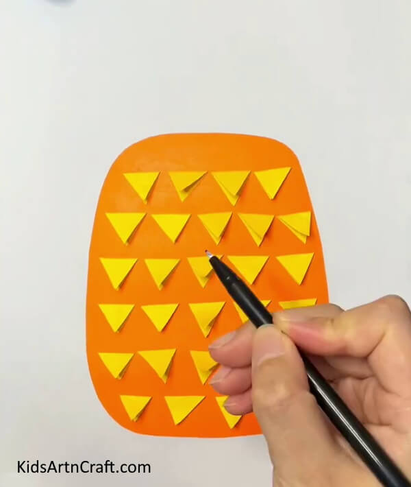 Take A Black Marker/ Sketchpen for highlight the Pineapple Paper Craft- An easy-to-follow Pineapple Paper Craft lesson for kids 