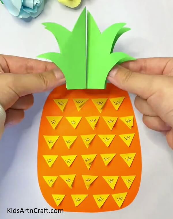 Make A Leaf Of The Pineapple With Green Craft Paper look real for kids- A tutorial on producing Pineapple Paper Crafts for children 