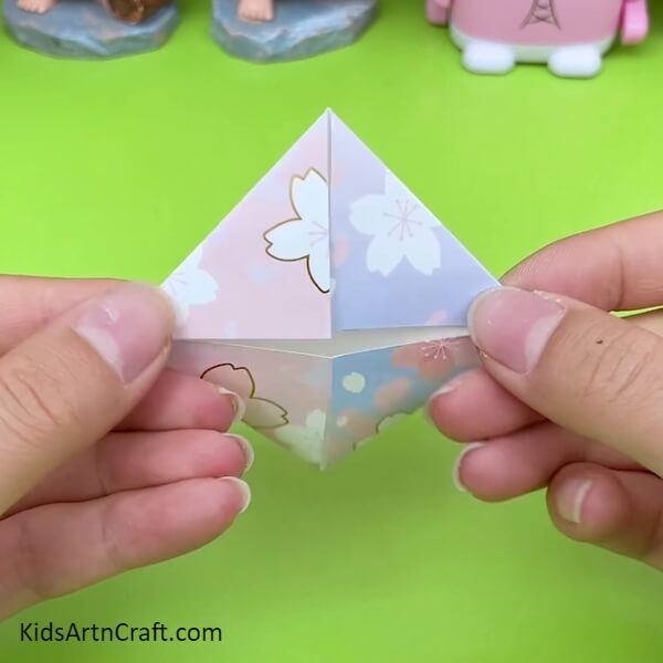 Fold All The Sides Of The Printed Craft Paper with proper diamond shape Craft Tutorial For Kids- Follow this Tutorial to Make an Adorable Origami Umbrella with Kids 