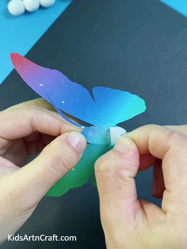Find The Double Tape And Paste It On The Body Of The Butterfly- Crafting a paper-straw butterfly - a tutorial for young ones