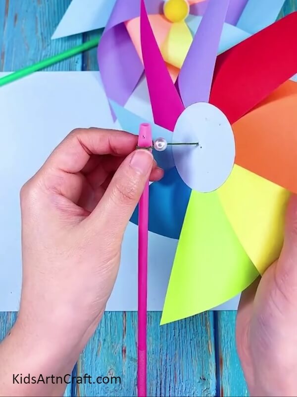 Attaching Straw With Windmill- A Walkthrough on Crafting a Rainbow Paper Windmill for Newcomers 