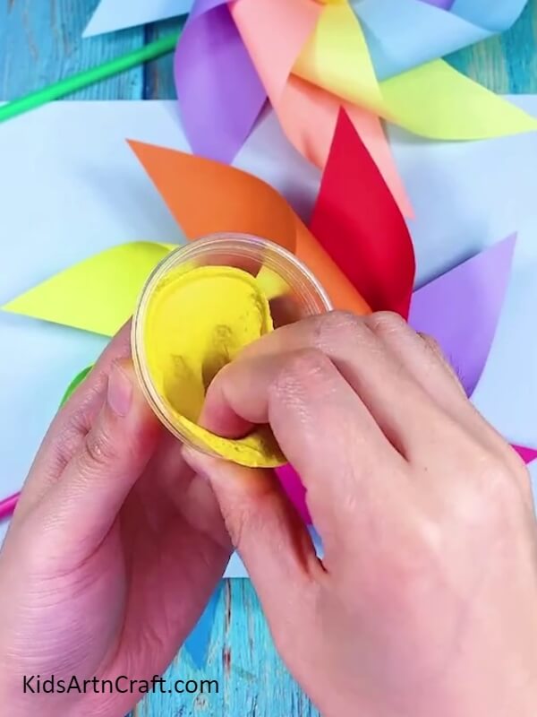 Taking Small Amount of Clay- Step-by-Step Guide to Creating a Rainbow Paper Windmill 