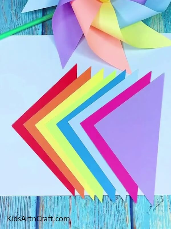 Cutting Remaining Color Papers in Triangle Shape- How to Make a Rainbow Paper Windmill in Easy Steps 