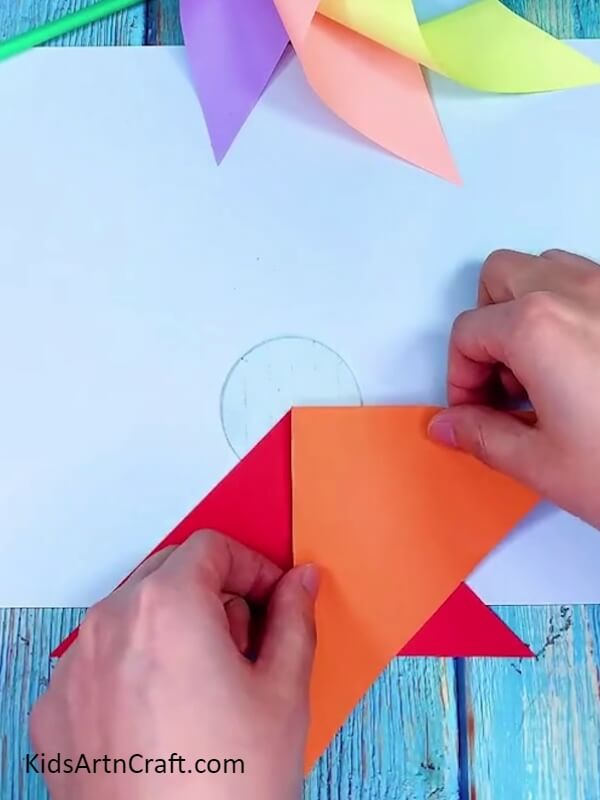 Pasting Orange Color Paper- How to Construct a Rainbow Paper Windmill the Simple Way 