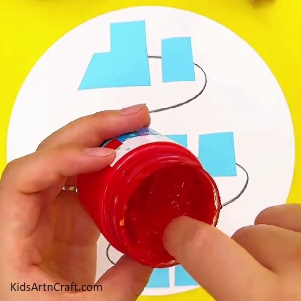 Dipping your finger into the red paint- A tutorial for constructing a train craft with youngsters 