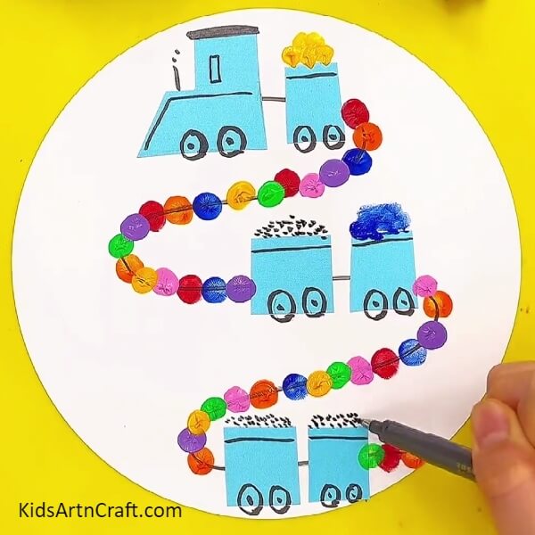 Adding coal using the marker- Making a train-themed art piece with kids 