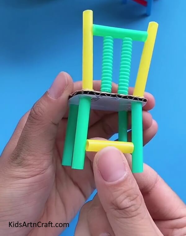 Paste a Straw Joining The Other Two Straws-. Constructing a Chair from Recycled Cardboard and Plastic Straws - Tutorial