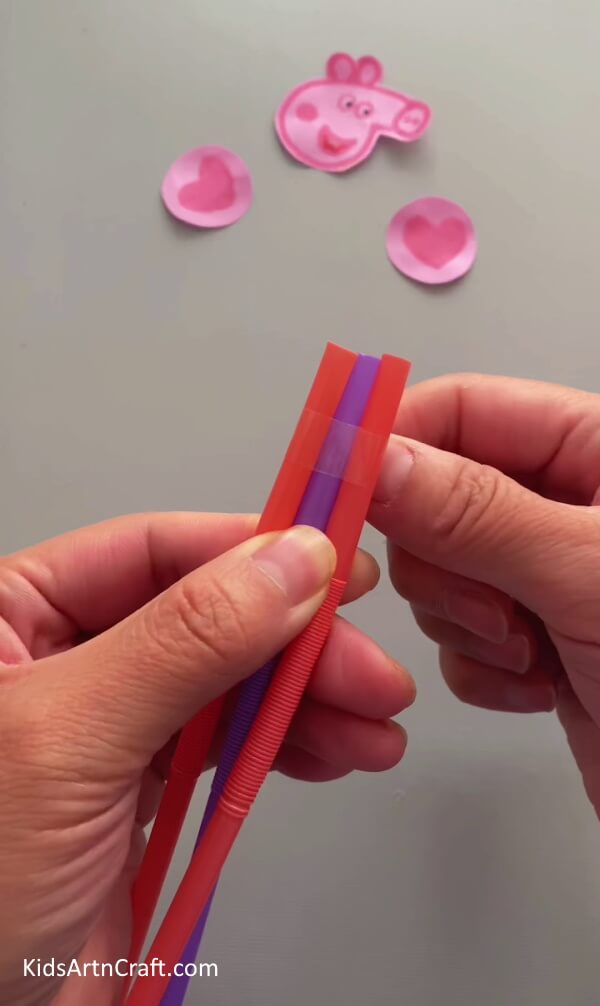 Starting with the Plastic Straws- Step-by-step guide on how to make a Peppa Pig ornament from reused paper cups for children. 