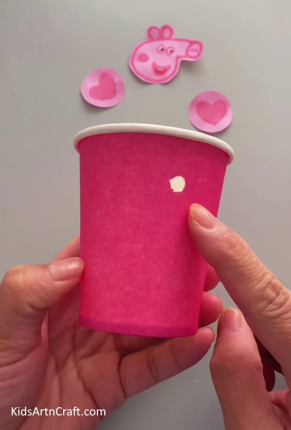 Working on the Paper Cup- This tutorial teaches young ones how to craft a Peppa Pig hanging decoration out of recycled paper cups. 