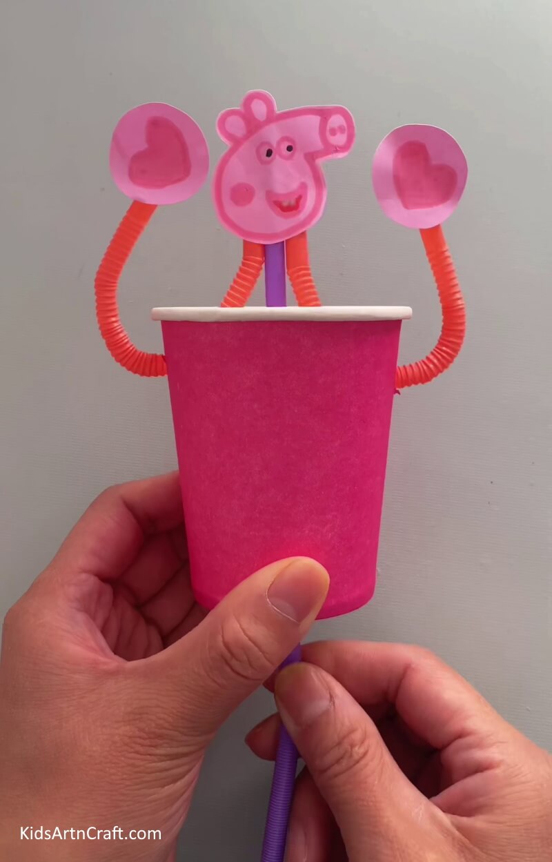 Happy Smiling Peppa Pig- Learn how to make a Peppa Pig hanging craft from used paper cups with this tutorial for kids.