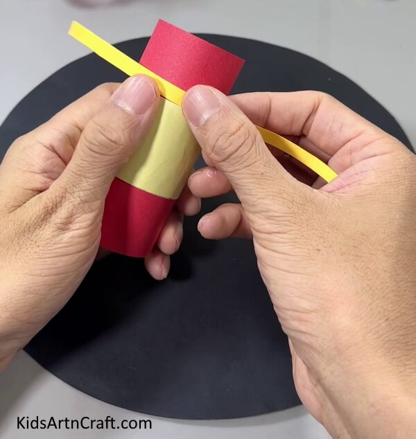 Pasting A Dark Yellow Strip Use Reused Toilet Paper Rolls to Make a Nutcracker Craft With Kids