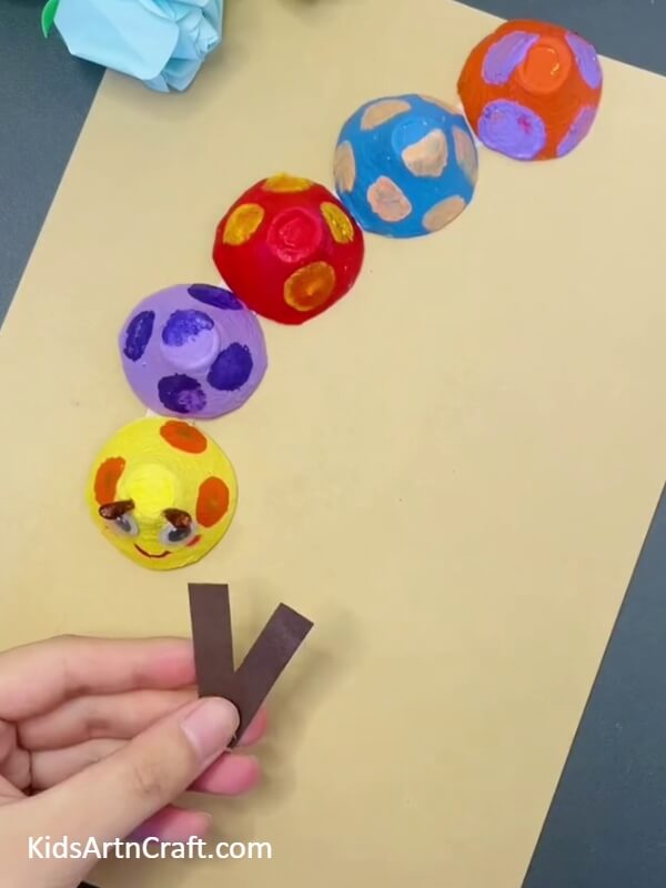 Starting With The Legs- Make a Creative Caterpillar from a Reused Egg Carton with This Simple Craft Tutorial for Children