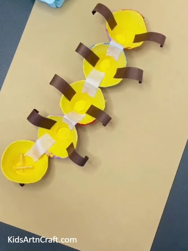 Finishing up!- Simple Instructions for Kids to Create a Caterpillar with an Egg Carton 