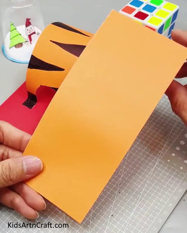 Cutting Out Another Orange Rectangle - Here is a step-by-step guide to crafting a paper tiger