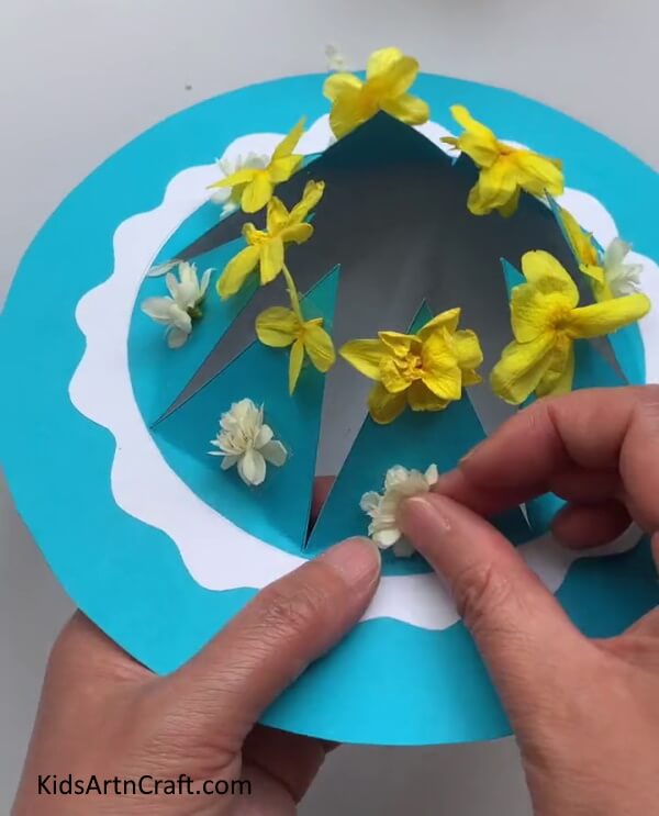 Completing Pasting Flowers - Making a charming Paper & Flower Topper for Children