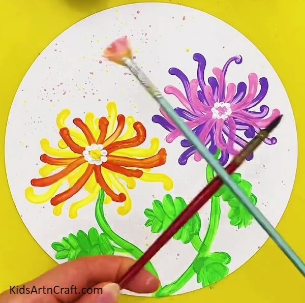 Spraying Paint On The White Background-Crafting an Unusual Flower Design with Cotton Buds