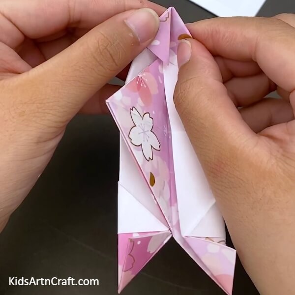 Folding The Corner Back with your hand- An Instructional Guide for Little Ones on How to Make a Special Paper Origami Boat 
