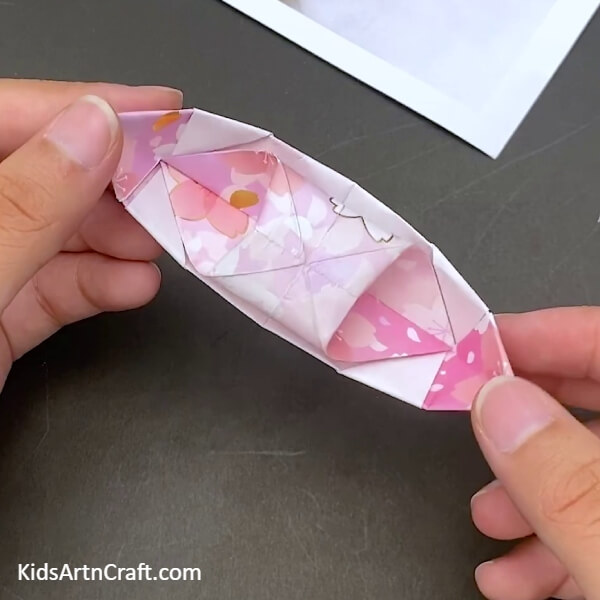  Adjusting The Sides Of The Flat Surface To Create a Paper Origami Boat- Step-by-Step Guide For Young Ones To Construct a Paper Boat Using Origami 