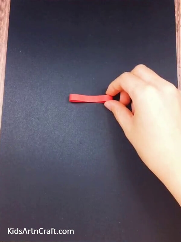 Paste the cutout on the black paper- How to Construct a Vivid Paper Flower Pot for Beginners