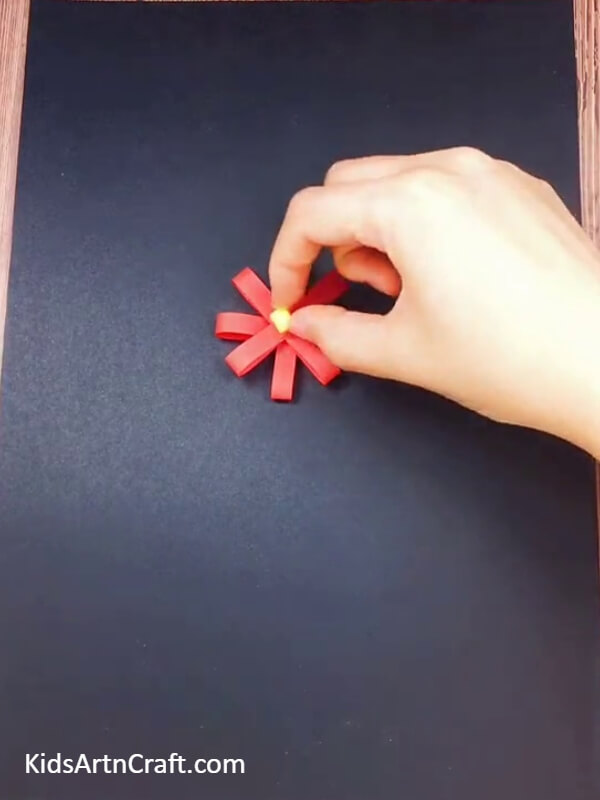 Paste a square cutout- Learn How to Make a Cheerful Paper Flower Pot 