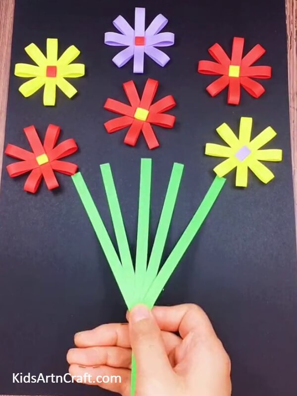 Cut more stripes of the green coloured paper- Tutorial for Making a Striking Paper Flower Pot for Beginners 