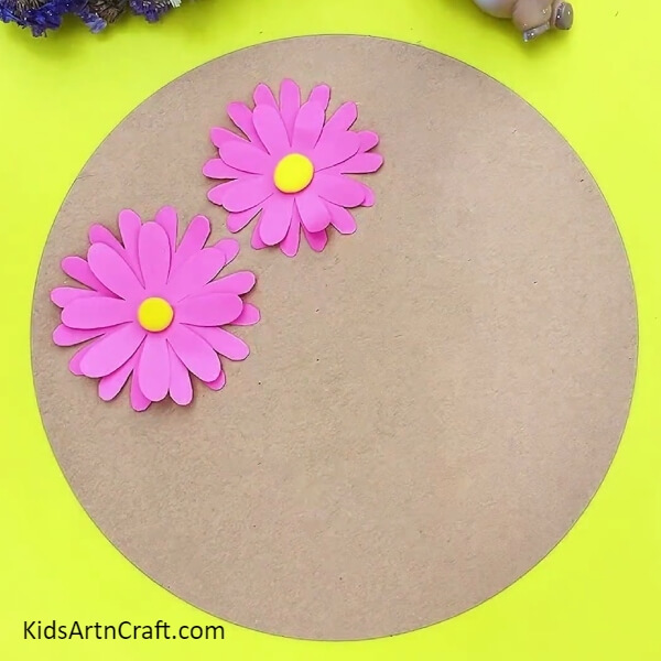 Creating second flower and pasting it on cardboard- A Fun Tutorial on Crafting 3D Flowers for Kids