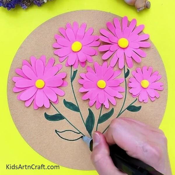 Drawing leaves with green sketch pen- Get Kids Crafting with This Step-by-Step 3D Flower Making Tutorial 