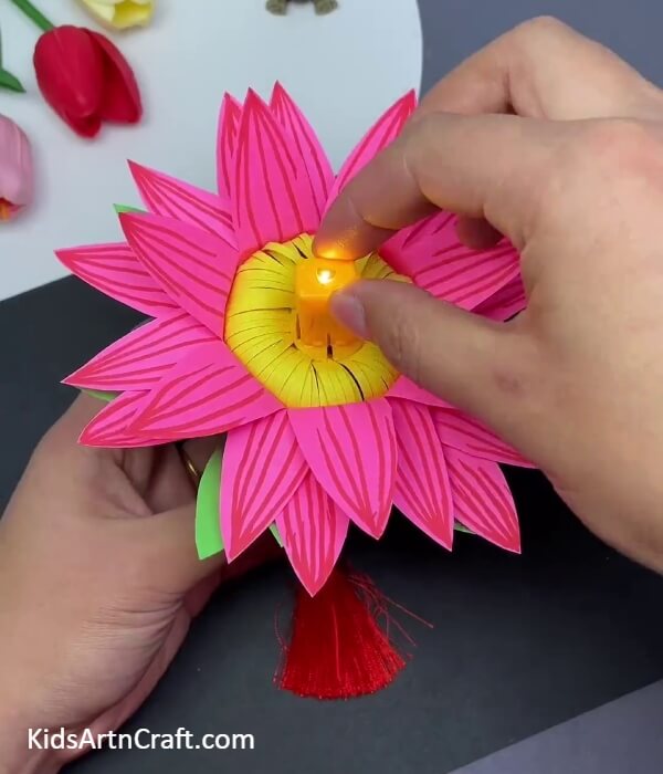 Attaching the simple lamp above the flower - Gorgeous Lotus Suspended Paper Craft Embellishment For Diwali