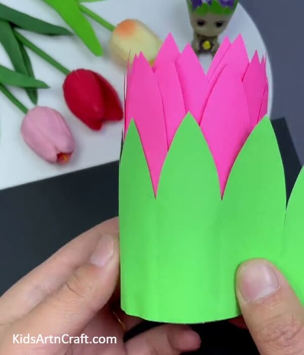 Sticking green craft paper for making sepal of the paper- Delightful Lotus Swinging Paper Art Decoration For Diwali