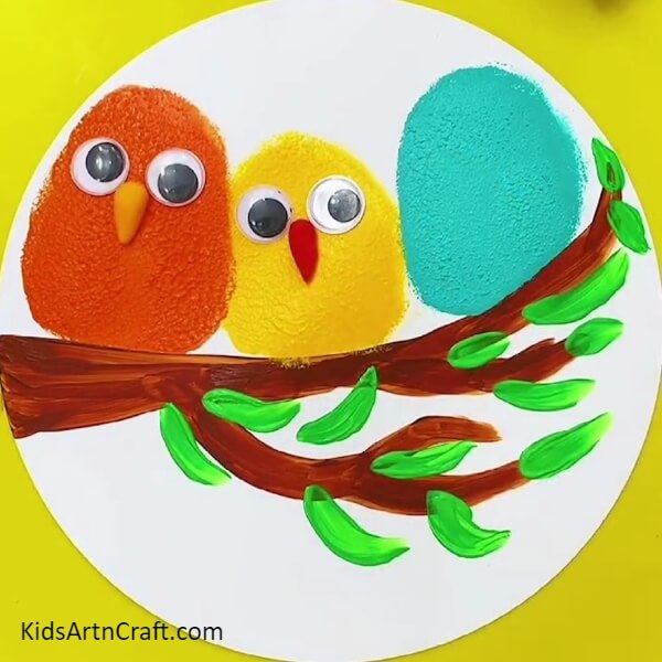 Adding The Beaks Of The Birds Using Clay- Create a painting of birds on a tree branch with this step-by-step guide 