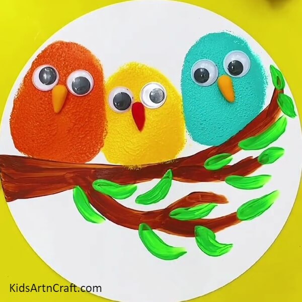 Adding The Beak And The Eyes On The Bluebird- Follow this tutorial to make a painting of birds on a tree branch 