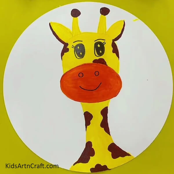 Drawing Giraffe's Nose And Mouth With A Black Pen- A beginner-friendly Giraffe face painting idea