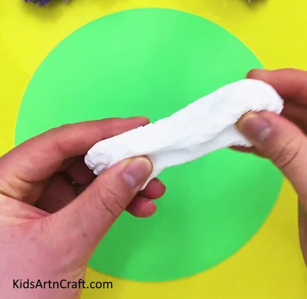 Taking Out A Piece Of Clay- A Guide on How to Make Clay Flowers Easily for Children 