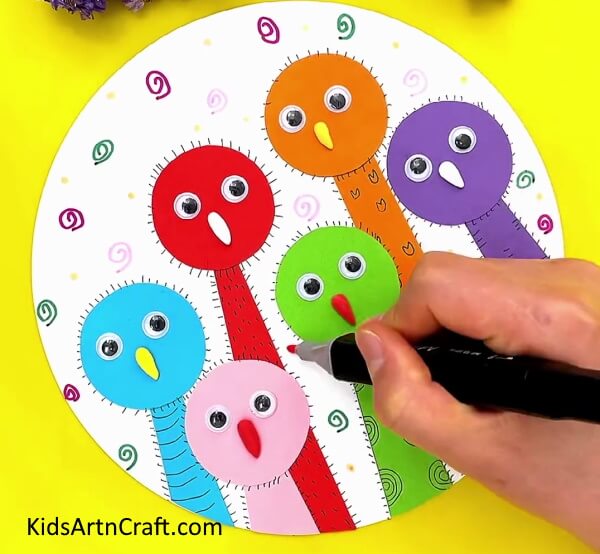 Making Random Spirals And Dots On The Base- Assemble a Paper Ostrich with this kid-friendly DIY tutorial. 