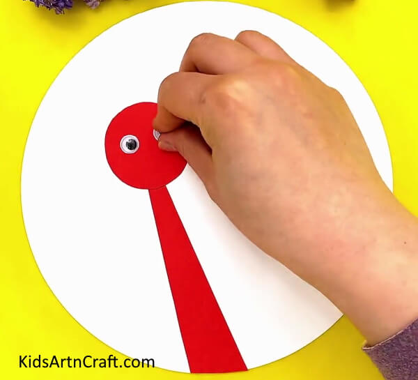 Pasting Googly Eyes- Follow this guide to craft a Paper Ostrich yourself with ease. 
