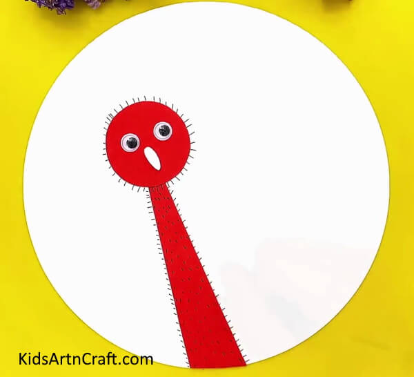 Making Hair On The Neck Of The Ostrich- This Paper Ostrich guide is designed with kids in mind. 